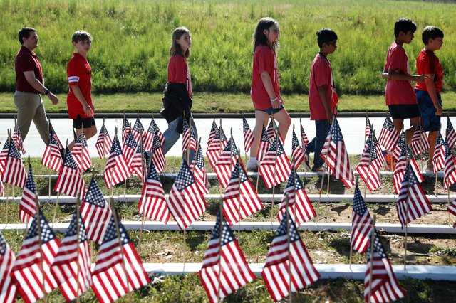 Liberty Middle School marks 25 years since 9/11 attacks with silence, songs and 3,000 flags